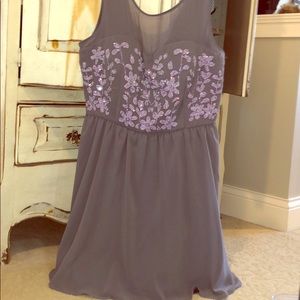 gray dress with beading and sheer neckline